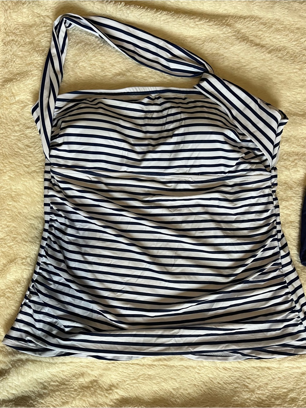 Striped Navy and White One-Shoulder tankini Top with navy bottoms.